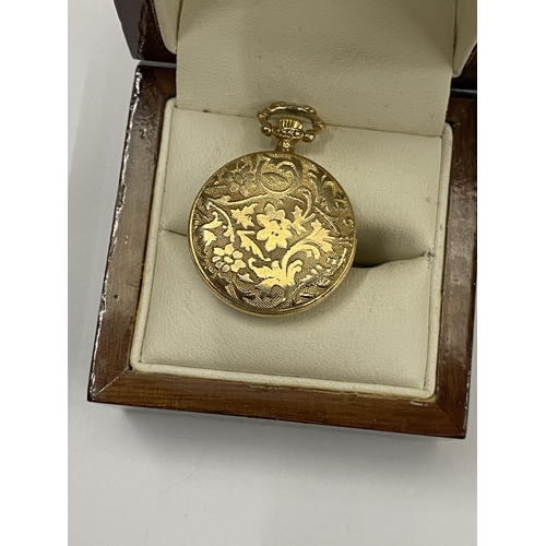 471 - A MINIATURE GILT DESIGN POCKET WATCH, BOXED