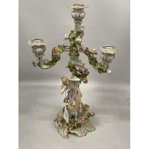 67 - A DRESDEN CONTINENTAL HARD PASTE PORCELAIN CHERUB THREE BRANCH CANDLESTICK, HEIGHT 45CM