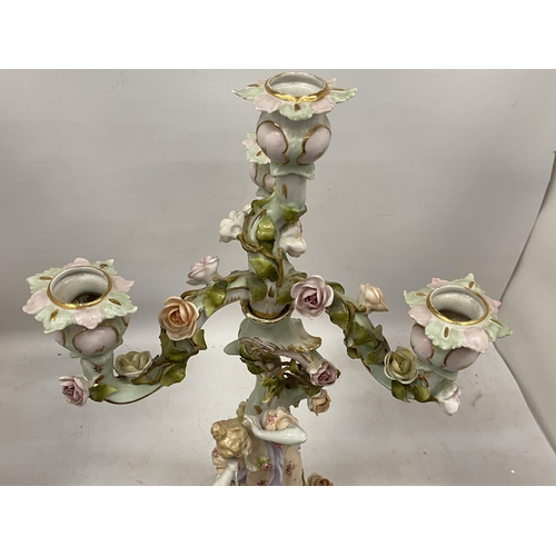 67 - A DRESDEN CONTINENTAL HARD PASTE PORCELAIN CHERUB THREE BRANCH CANDLESTICK, HEIGHT 45CM