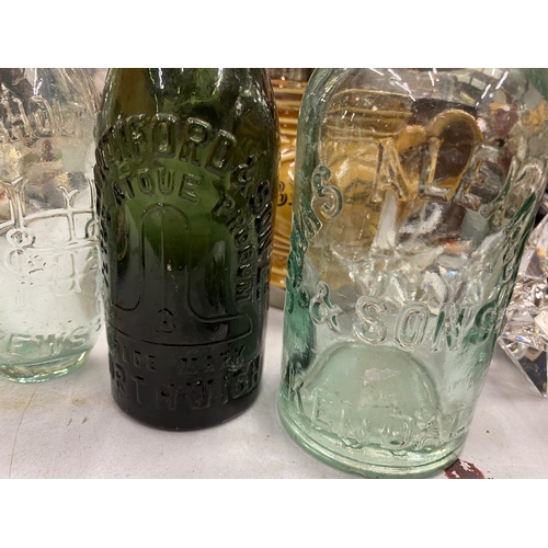 135 - FOUR VINTAGE GLASS BOTTLES