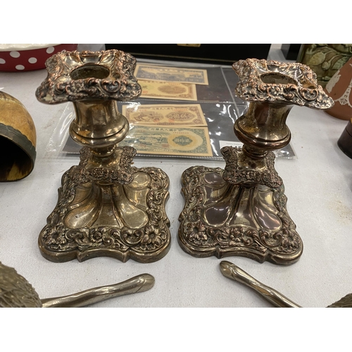 144 - A PAIR OF HEAVY WHITE METAL STAG ORNAMENTS AND A PAIR OF PLATED CANDLESTICKS