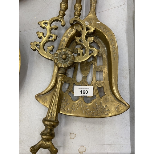 160 - A LARGE BRASS SHOVEL AND TONGS