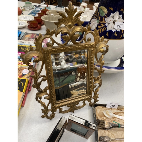 210 - A BRASS MIRROR WITH BEVELLED GLASS, WOOD PICTURE FRAME, SPOON SET, KNIFE SHARPENER, ETC