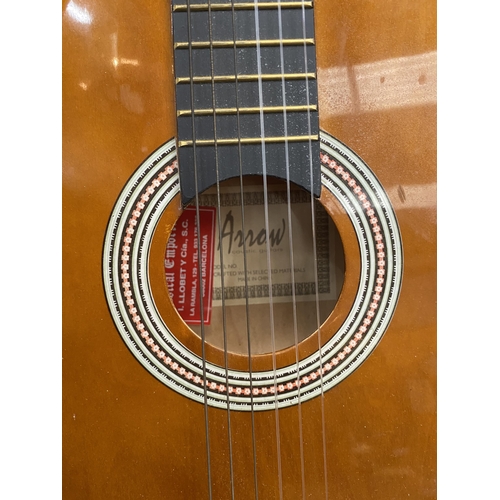 216 - A VINTAGE WOODEN ACOUSTIC GUITAR