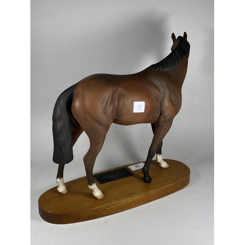 85 - A BESWICK MATT CERAMIC MODEL OF DERBY WINNING RACEHORSE TROY ON WOODEN PLINTH BASE