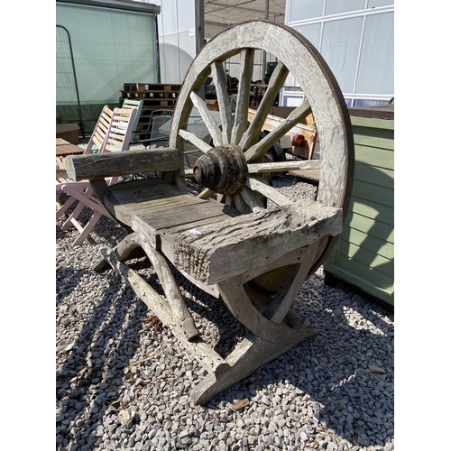 1990 - A DECORATIVE WOODEN GARDEN BENCH WITH CART WHEEL BACK