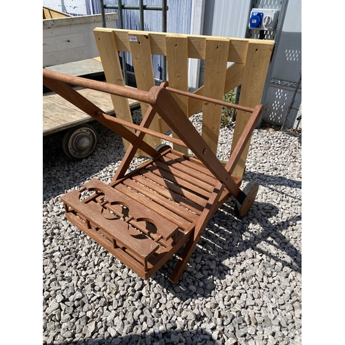 1994 - A WOODEN DRINKS TROLLEY AND A WOODEN GATE