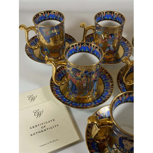 723 - A COMPTON AND WOODHOUSE 'THE WONDERS OF THE NILE' TUTANKHAMUN GILT SET OF SIX CUPS AND SAUCERS WITH ... 