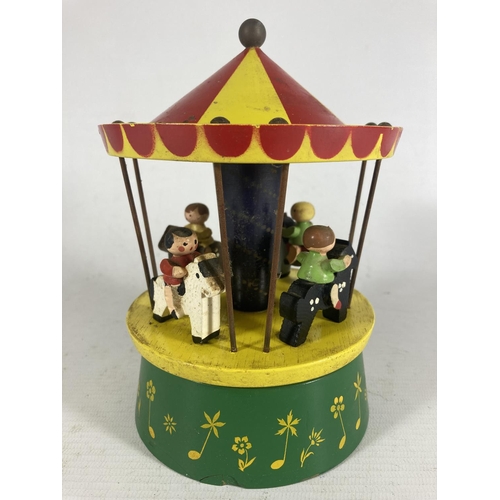 360 - A RARE VINTAGE REUGE WODDEN MERRY-GO-ROUND WITH SWISS MUSICAL MOVEMENT