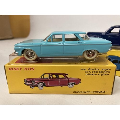 375 - FIVE BOXED DINKY ATLAS MODELS TO INCLUDE A STUDEBAKER COUPE (NO 39F), A PEUGEOT 402 'TAXI' (NO 24L),... 