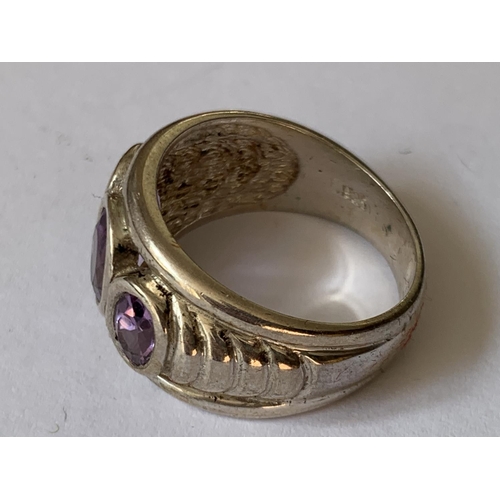 548 - A SILVER AND AMETHYST RING IN A PRESENTATION BOX