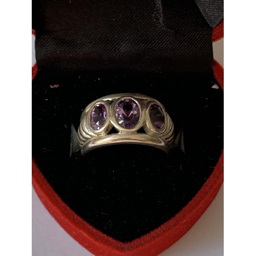 548 - A SILVER AND AMETHYST RING IN A PRESENTATION BOX