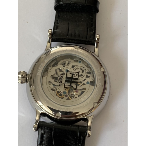 580 - A GENTS EARNSHAW SKELETON AUTOMATIC WRISTWATCH