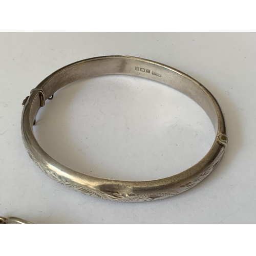 594 - TWO SILVER BRACELETS AND A SILVER BANGLE