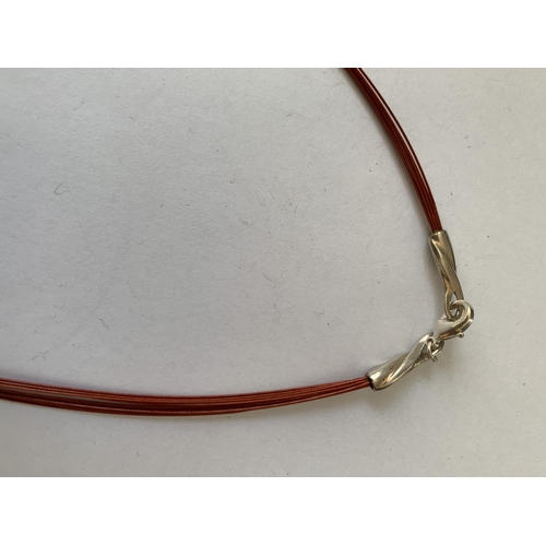 597 - A SILVER AND AMBER NECKLACE