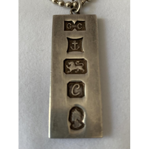 615 - A SILVER INGOT IN A PRESENTATION BOX