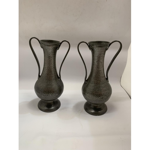 110 - A PAIR OF ARTS AND CRAFTS STYLE TWIN HANDLED PEWTER  VASES