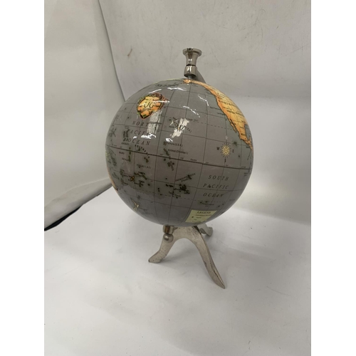 139 - A WORLD GLOBE ON A STAND