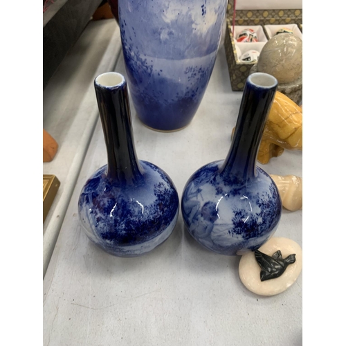 150 - A ROYAL DOULTON FLAMBE VASE - SMALL CHIP TO BASE PLUS A LARGE AND TWO SMALLER BLUE VASES - ALL A/F