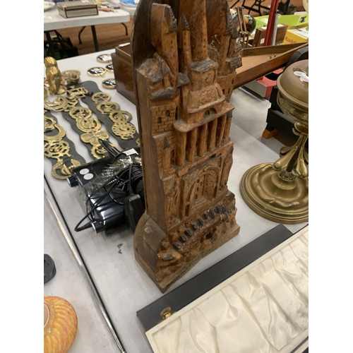 155 - A VINTAGE WOODEN CARVING OF A CASTLE WITH A CREATURE UNDERNEATH SIGNED SOUDANI, HEIGHT 45CM