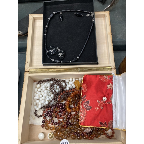 202 - A LARGE MIXED LOT OF COSTUME JEWELLERY, BOXED ITEMS, WOODEN BOX ETC