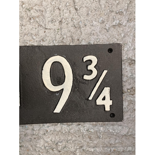 204 - A CAST 'PLATFORM 9 3/4' HARRY POTTER RAILWAY SIGN, LENGTH 58.5CM