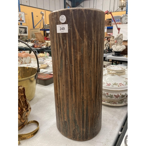 249 - A VINTAGE HARDWOOD CANDLE HOLDER