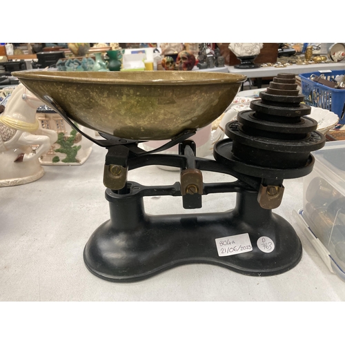 804A - A VINTAGE SET OF WEIGHING SCALES WITH CAST AND BRASS WEIGHTS