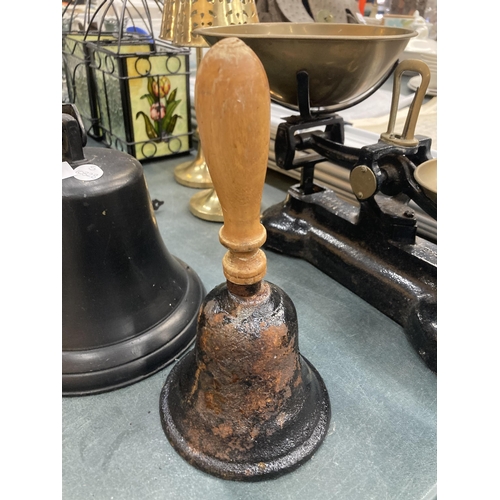 845 - TWO VINTAGE BELLS TO INCLUDE A WOODEN HANDLED EXAMPLE