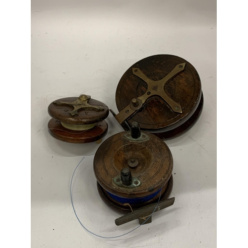 12 - A COLLECTION OF THREE VINTAGE WOODEN FISHING REELS