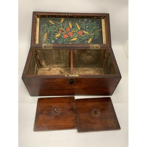 25 - A VINTAGE MAHOGANY TEA CADDY WITH TWO INNER COMPARTMENTS