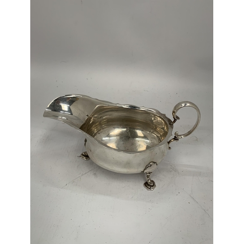 27 - A HALLMARKED SILVER SAUCE / GRAVY BOAT ON HOOF DESIGN FEET