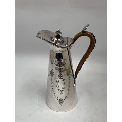 34 - A VINTAGE SILVER PLATED WATER JUG