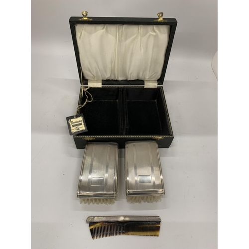 4 - A VINTAGE CASED BIRMINGHAM HALLMARKED SILVER TWIN BRUSH AND COMB SET