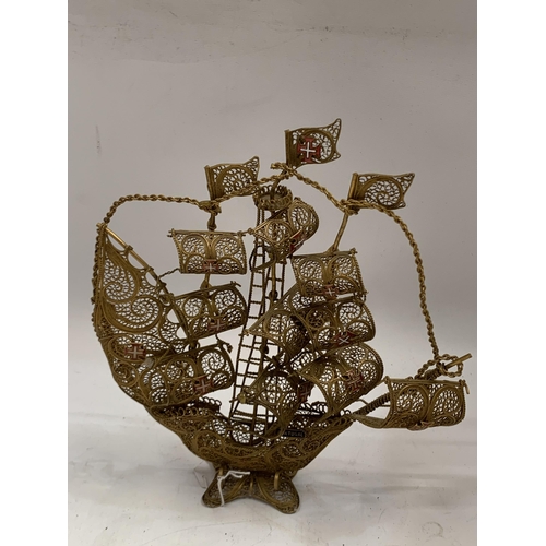 45 - AN ORNATE GILT FILIGREE MODEL OF A SAILING SHIP, HEIGHT 21CM