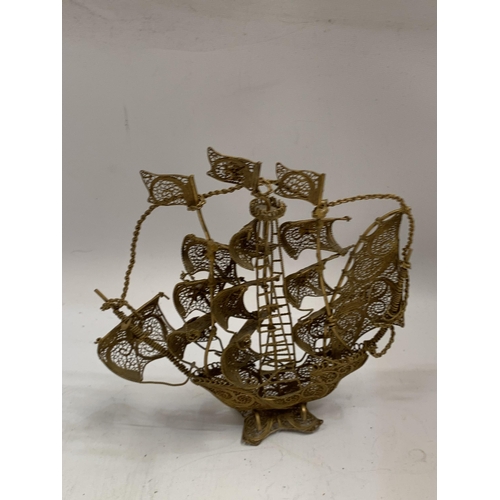 45 - AN ORNATE GILT FILIGREE MODEL OF A SAILING SHIP, HEIGHT 21CM