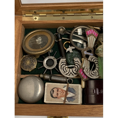 48 - A GLASS AND WOODEN DISPLAY CASE CONTAINING ASSORTED COLLECTABLES