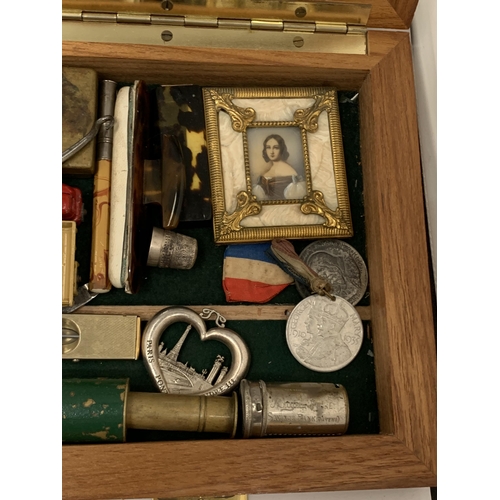 48 - A GLASS AND WOODEN DISPLAY CASE CONTAINING ASSORTED COLLECTABLES