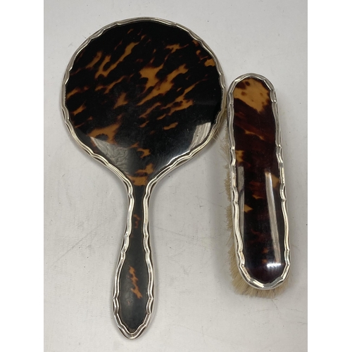 52 - A HALLMARKED SILVER AND TORTOISESHELL EFFECT HAND MIRROR AND BRUSH