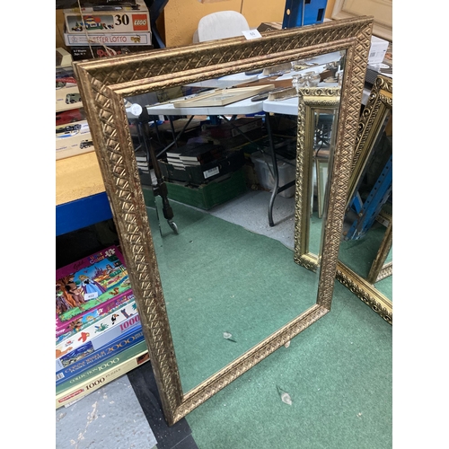 60 - A LARGE GILT FRAMED BEVEL EDGED WALL MIRROR, 73 X 104CM