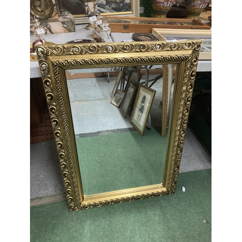 68 - A LARGE GILT FRAMED BEVEL EDGED WALL MIRROR, 57 X 82CM