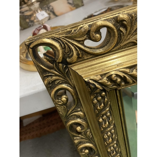 68 - A LARGE GILT FRAMED BEVEL EDGED WALL MIRROR, 57 X 82CM