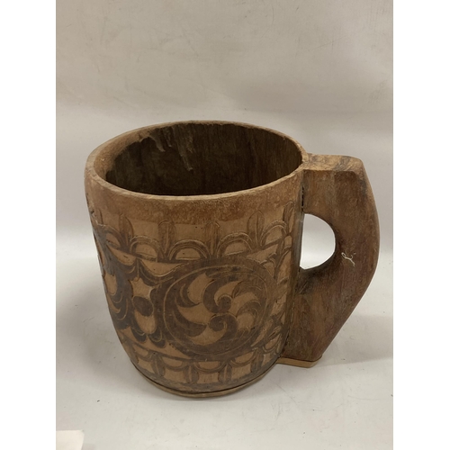 81 - A LARGE VINTAGE TRIBAL WOODEN MUG, HEIGHT 25CM