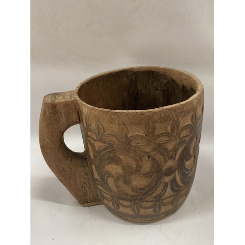 81 - A LARGE VINTAGE TRIBAL WOODEN MUG, HEIGHT 25CM