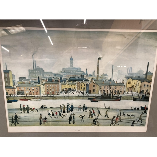 89 - A FRAMED L.S LOWRY 'NORTHERN RIVER SCENE' PRINT