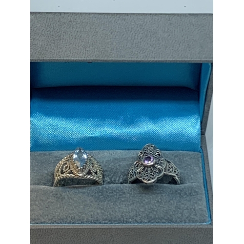 653 - TWO DECORATIVE SILVER RINGS IN A PRESENTATION BOX