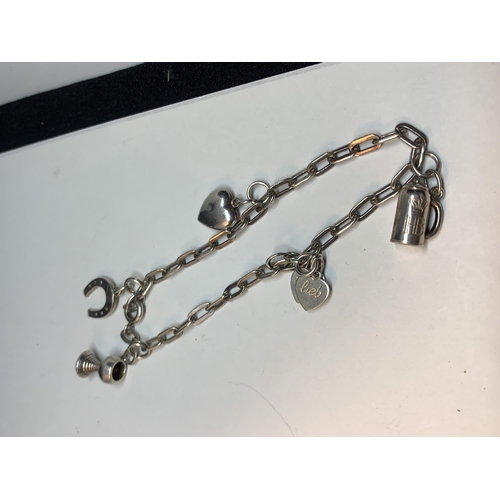 672 - THREE SILVER CHARM BRACELETS