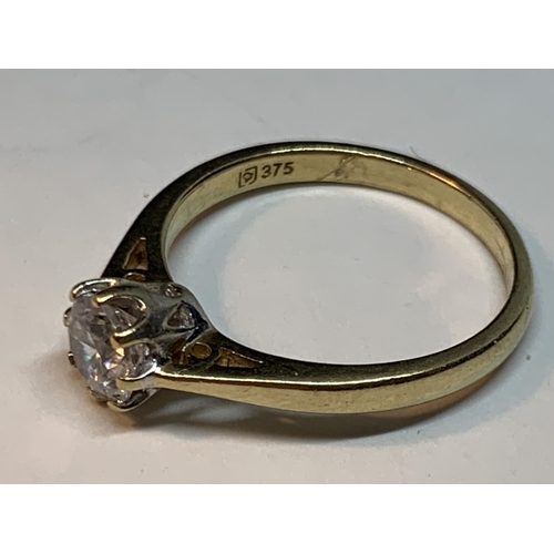 680 - A 9 CARAT GOLD RING WITH A SOLITAIRE CUBIC ZIRCONIA SIZE M