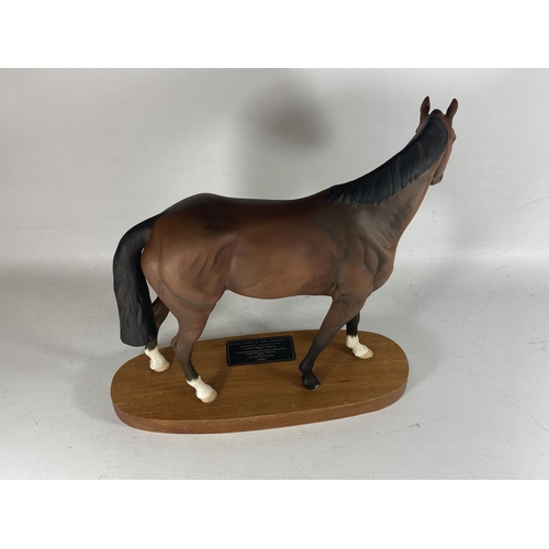 751 - A BESWICK MATT CERAMIC MODEL OF DERBY WINNING RACEHORSE TROY ON WOODEN PLINTH BASE