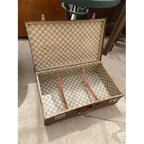 1853 - A GLASS TOPPED BISTRO TABLE AND A TRAVEL CASE